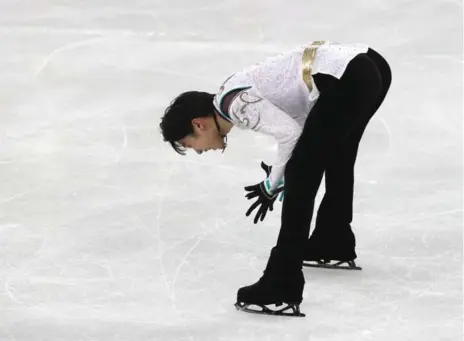  ?? STEVE RUSSELL/TORONTO STAR ?? Yuzuru Hanyu won the men’s figure skating title for a second time, combining the athleticis­m of four quads with the grace of a defending champion.