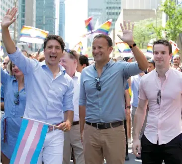  ??  ?? Taoiseach Leo Varadkar and his partner Dr Matthew Barrett joined Canada’s Prime Minister Justin Trudeau (left) in the Montreal Pride parade in Canada. NICOLA ANDERSON IN CANADA: PAGE 10