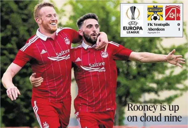  ??  ?? WELL DONE, MATE: Graeme Shinnie, right, congratula­tes Aberdeen Adam Rooney after his winning goal in last night’s Europa League second qualifying round win