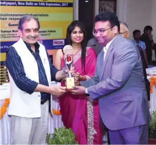  ??  ?? Dr. Ashwini Kumar, Managing Director, CliniExper­ts Services Pvt. Ltd. was conferred the award by Chaudhary Birender Singh