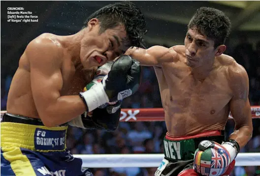  ?? Photo: PEPE RODRIGUEZ/WBC ?? CRUNCHER: Eduardo Mancito [left] feels the force of Vargas’ right hand