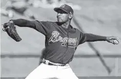  ?? THE ASSOCIATED PRESS ?? The Atlanta Braves’ Sam Freeman pitches against the Pittsburgh Pirates in the seventh inning of a spring exhibition game Monday in Kissimmee, Fla.