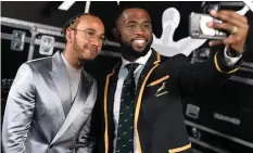  ??  ?? SIYA Kolisi takes a selfie with Lewis Hamilton at the Laureus World Sports Awards in Berlin on Monday.