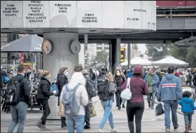  ?? Maja Hitij / Getty Images ?? People walk near Alexanderp­latz on Oct. 15 in Berlin, Germany. COVID-19 daily infection rates topped 6,000 nationwide on Oct. 15 after rising steadily since August and mirroring similar trends across Europe.