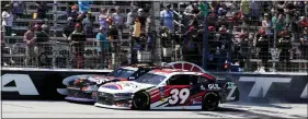  ?? LARRY PAPKE — ASSOCIATED PRESS ?? Sam Mayer, rear, edges Ryan Sieg (39) at the finish line to win the Xfinity Series race in Fort Worth, Texas on Saturday.