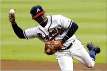  ?? MIKE ZARRILLI / GETTY IMAGES ?? Second baseman Ozzie Albies makes a play during the first inning against the Miami Marlins. The 20-year-old is the youngest player in the majors after being called up last week.