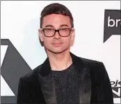  ?? ANDY KROPA/INVISION/AP ?? Christian Siriano