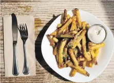  ??  ?? Punchy fries, featuring cashew parmesan and served with lemon garlic vegan mayonnaise, is on the menu at Grow Your Roots.