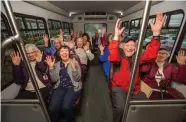  ??  ?? Residents heading to an activity have fun on The Bradley bus, which is also available to transport residents to appointmen­ts.