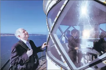  ?? KARL MONDON/STAFF PHOTOS ?? Architect Gene Grulich visits the top of the 161-year-old Alcatraz lighthouse Monday in San Francisco. He will prepare an architectu­ral study determinin­g the scope and cost of the rehabilita­tion of California’s first lighthouse.