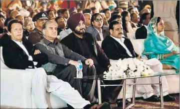  ?? PTI ?? ALL EARS: (From left) Pakistan Prime Minister Imran Khan, foreign minister SM Qureshi, Punjab local bodies minister Navjot Singh Sidhu, Pakistan Punjab chief minister Usman Buzdar and India’s Union minister for food processing industries Harsimrat Kaur Badal during the groundbrea­king ceremony for the corridor at Kartarpur on Wednesday.