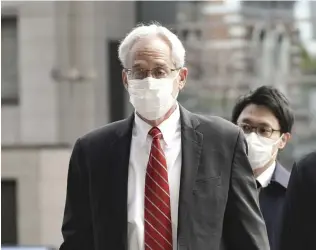  ?? Yomiuri Shimbun file photo ?? Greg Kelly enters the Tokyo District Court on March 3.