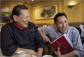  ?? KARL MONDON — BAY AREA NEWS GROUP ?? Lawrence C.C. Chu and his son, Larry Chu, Jr., talk about the venerable Chef Chu restaurant in Los Altos.