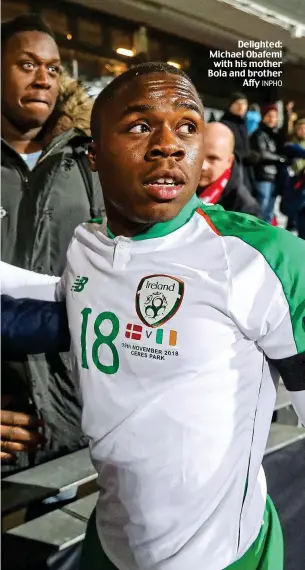  ?? INPHO ?? Delighted: Michael Obafemi with his mother Bola and brother Affy