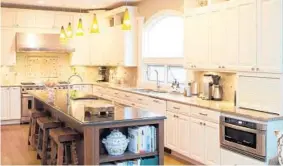  ??  ?? A 2008 renovation had delivered the couple’s dream kitchen: an open floor plan with ample counter space and an island