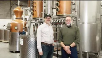  ?? The Canadian Press ?? Partners Barry Bernstein, left, and Barry Stein of Still Waters Distillery, pose in Toronto on Wednesday. Canadian microdisti­llers are making a name for themselves with quality spirits that are winning awards along with kudos from thirsty customers.