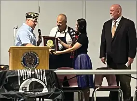  ?? RECORDER PHOTO BY ESTHER AVILA ?? American Legion Post 20 Commander Mike Smith, left, accepts a plaque from Eddie Hernandez and Amanda Yan, as Supervisor Dennis Ennis watches.