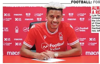  ??  ?? ALWAYS A RED…
Lyle Taylor swapped the crimson of Charlton for Forest’s Garibaldi red, left DX1ST