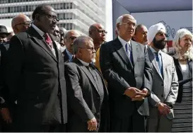  ?? Godofredo A. Vasquez / Houston Chronicle ?? Religious leaders of various faiths listen as Mayor Sylvester Turner launches the “Meaningful Change” campaign, which helps the homeless move into apartments.