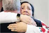  ??  ?? Tanya Ibar, the defendant’s wife, hugs his defense lawyer Kevin Kulik after Pablo Ibar was sentenced to life in prison.