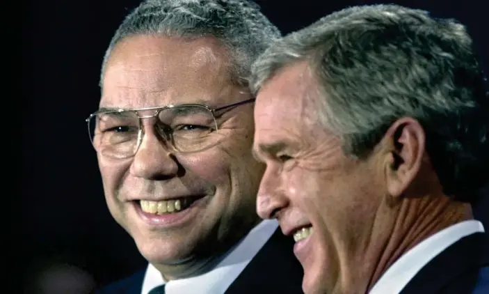  ?? Photograph: David J Phillip/AP ?? Colin Powell with George W Bush in 2000.