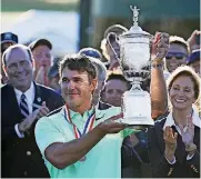  ?? [AP PHOTO] ?? Brooks Koepka holds up the winning trophy after the U.S. Open golf tournament Sunday at Erin Hills in Erin, Wis.