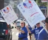  ??  ?? Members of Amalgamate­d Transit Union Local 107 at a Keep Transit Public rally at Hamilton City Hall Wednesday morning.