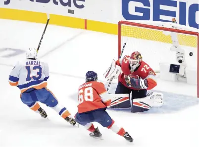  ?? ANDRE RINGUETTE/ Getty Images ?? The Islanders’ Mathew Barzal fires the puck past Sergei Bobrovsky for the back-breaking goal in the third period that put the game out of the Panthers’ reach. Barzal had a step on Mike Hoffman, who scored the only Florida goal in the defeat.