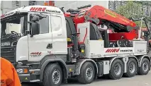  ??  ?? One of the latest additions to the fleet is ‘‘Jock’’, the $1 million knuckle boom crane deployed in Christchur­ch.