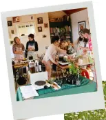  ??  ?? Some of Marina’s students (above) learning to make herbal remedies. Chickens among the wild flowers in the garden (right)