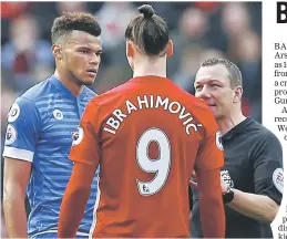  ??  ?? Manchester United’s Zlatan Ibrahimovi­c (centre) and Bournemout­h’s Tyrone Mings are spoken to by referee Kevin Friend during the English Premier League football match at Old Trafford in Manchester, north west England in this March 4 file photo. —...