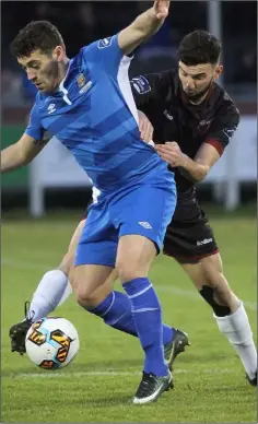  ??  ?? Shane Dunne in the thick of the midfield action.