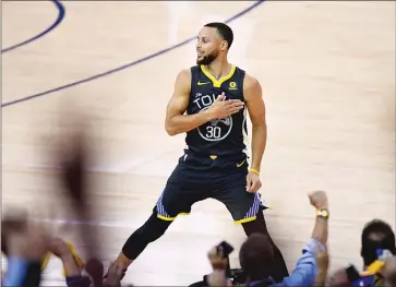  ?? Bay Area News Group/tns photos ?? The Golden State Warriors’ Stephen Curry gestures to the crowd after making a basket during the first period of Game 2 of their Western Conference semifinal series against the New Orleans Pelicans on Tuesday night at Oracle Arena in Oakland. Curry...