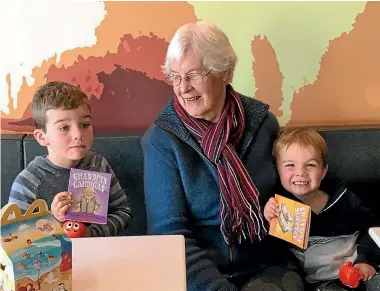  ?? Book covers: SCHOLASTIC NZ ?? Joy Watson with two of her great-grandsons and, right, as a young dental nurse. Her copies, and the books are still in print 30 years after their first publicatio­n. series has sold hundreds of thousands of