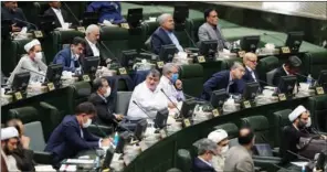  ??  ?? A handout picture provided by Icana News Agency on Sunday shows Iranian parliament members attending a meeting in the capital Tehran.