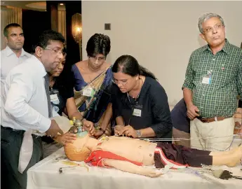  ??  ?? The medical team attending to Sim Junior while checking his vital signs. Pix by Amila Gamage