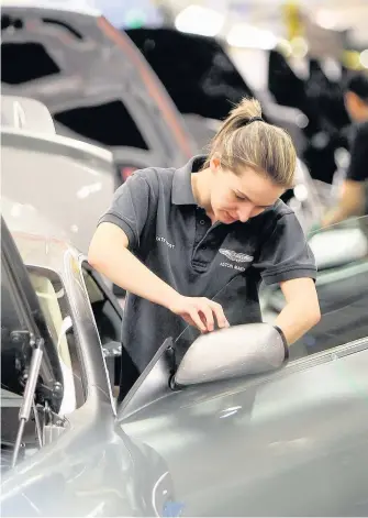  ??  ?? > Aston Martin has plants in Gaydon, Warwickshi­re, and St Athan, Vale of Glamorgan