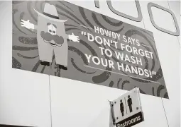  ?? Jon Shapley / Staff photograph­er ?? A sign at the Houston Livestock Show and Rodeo in March reminds people to wash their hands. The event was shut down early this year.