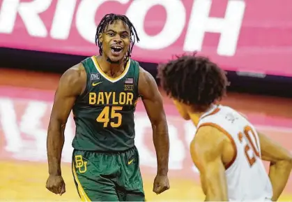  ?? Eric Gay / Associated Press ?? Baylor guard Davion Mitchell has reason to smile as his 27-point game led the Bears to their 17th consecutiv­e victory to start the season and left them three games clear of the pack in the loss column in the Big 12 standings.