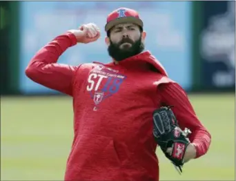  ?? THE ASSOCIATED PRESS ?? Phillies pitcher Jake Arrieta throws during a workout Tuesday’s exhibition game against the Tampa Bay Rays on Tuesday.