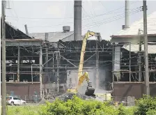  ?? DAN JANISSE ?? An old factory is among 250 buildings to be demolished in Detroit’s Delray neighbourh­ood to make way for a new bridge plaza.