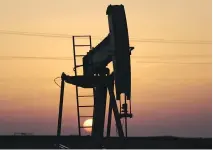  ?? HASAN JAMALI/AP FILES ?? An oil pump is shown in the desert oilfields of Sakhir, Bahrain. The stakes are raised for investors as OPEC and its partners will decide whether to extend the output agreement next week.