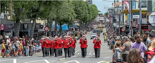  ?? PHOTOS: ANDY MACDONALD/STUFF ?? The Devon Hotel New Plymouth Brass Band parade along Devon St in front of large crowds.