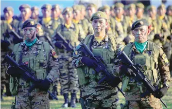  ??  ?? Soldiers march during the 121st anniversar­y celebratio­n of the Philippine Army at Taguig city. The Philippine­s station a marine unit on the island of Y’ami about 80 kilometres from Taiwan. — Reuters