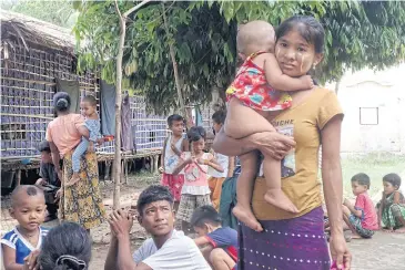  ?? AFP ?? Residents, who fled from conflict between the Myanmar army and the Arakan Army, arrive at a temporary refugee camp at a monastery in Sittwe, Rakhine state on Monday.