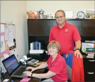  ?? TAMMY KEITH/RIVER VALLEY & OZARK EDITION ?? Capts. Trish and Michael Knott work in her office at The Salvation Army in Conway. Trish is a former certified public accountant and a controller for a casino in Oklahoma, and Michael was a band teacher, as well as a funeral-home director and embalmer,...