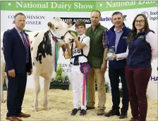  ??  ?? Coolquill Hagley 1417, owned by Tom Black (handler: Michael Blake) was the Highest EBI Holstein at the recent National Dairy Show, pictured with joint sponsors Christine Cummins Bonanza Calf Nutrition and John Lynch Kelleher’s Agri Feed &amp; Farm Supplies, Ballymulle­n, Tralee. Photo: Maria Kelly