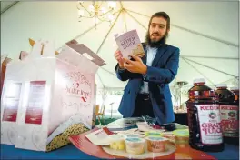  ?? PHOTO BY WATCHARA PHOMICINDA — THE PRESS-ENTERPRISE/SCNG ?? Rabbi Shmuel Fuss holds a Passover Seder guide from a to-go kit during the coronaviru­s pandemic at Chabad Jewish Community Center of Riverside in Riverside. The Jewish holiday of Passover begins March 27.