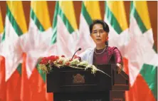  ?? Ye Aung Thu / AFP / Getty Images ?? Aung San Suu Kyi refused to criticize the military, which has been accused of killing, rape and burning Rohingya villages.