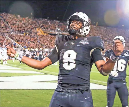  ?? REINHOLD MATAY/USA TODAY SPORTS ?? UCF QB Darriel Mack has filled in since McKenzie Milton’s injury Nov. 23. In his only start, he had six TDs (two passing, four rushing).